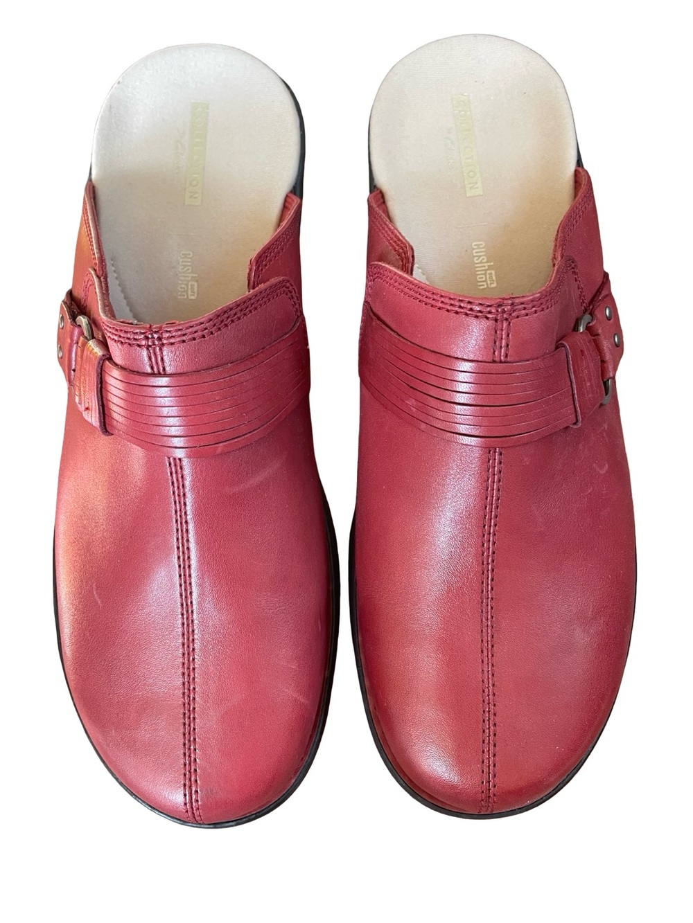 Clarks Patty Lorene Red Leather slip-on clogs with a buckle detail